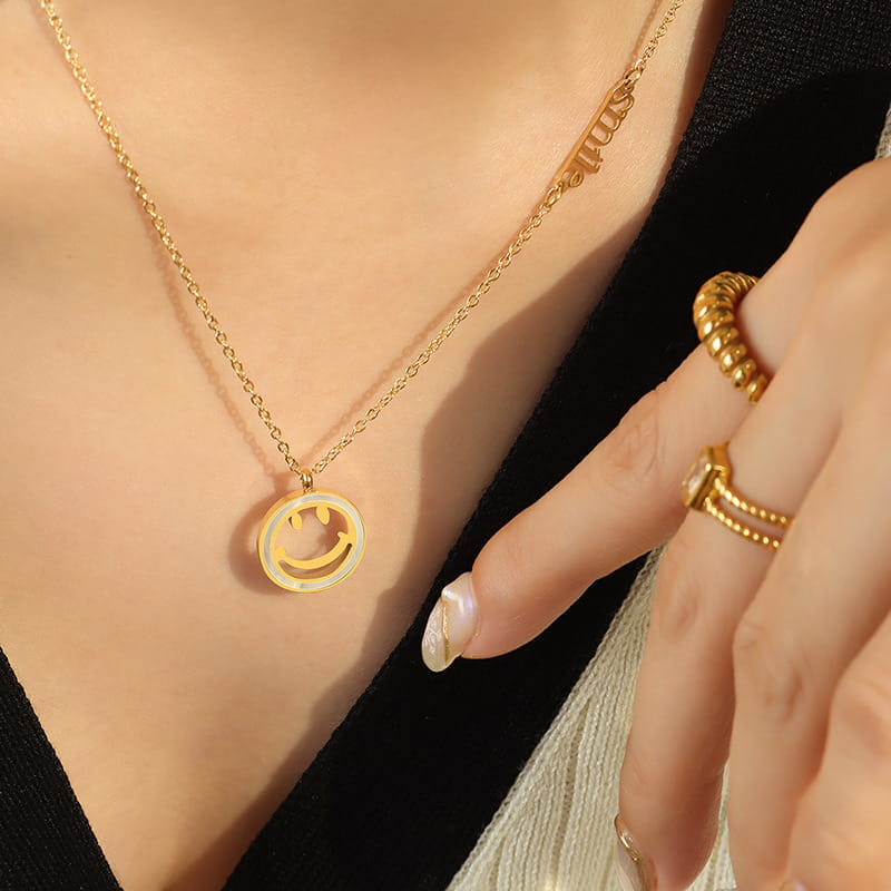 Model wearing the White Gold Initial Shell Smiley Necklace, stainless steel jewelry with shell pendant