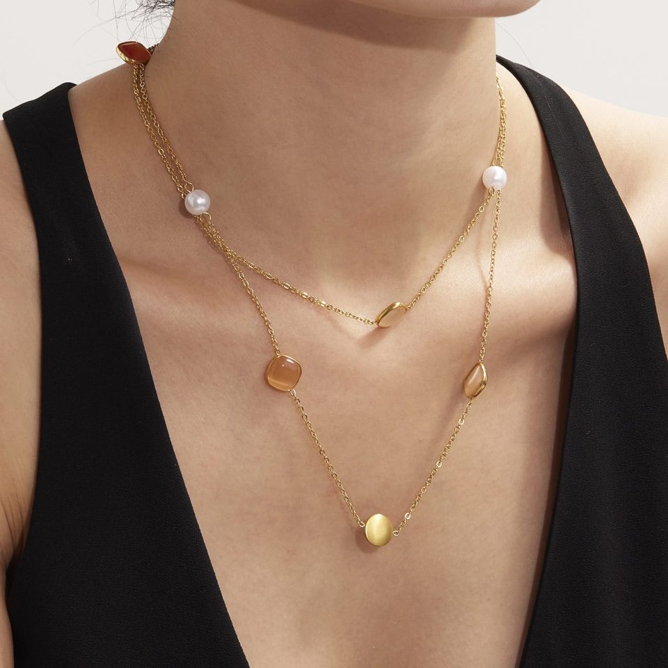 Model wearing a gold necklace with a yellow square TXP274