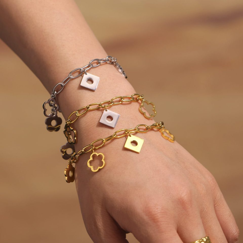 Model wearing a gold steel bracelet E603