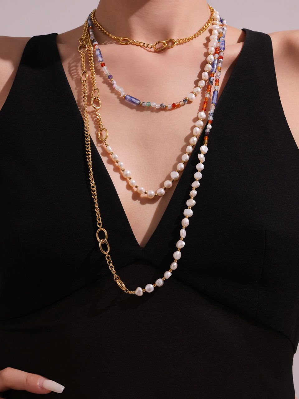 Model wearing Fashion Natural Freshwater Pearl Natural Stone Sweater Necklace, gold long chain style