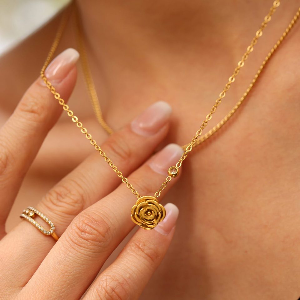 Close-up of Gold Shell Earrings with Freshwater Pearl Pendant and Cubic Zirconia – Folded View on Model