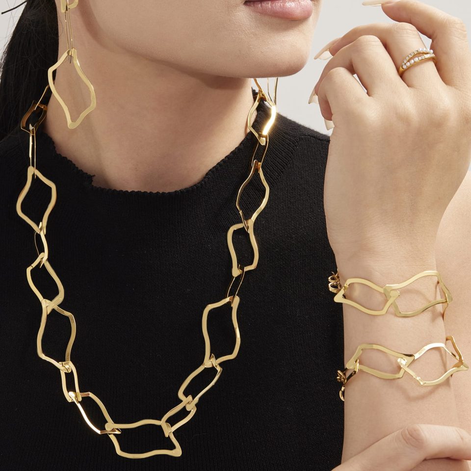 Model wearing gold bracelet TXE355--