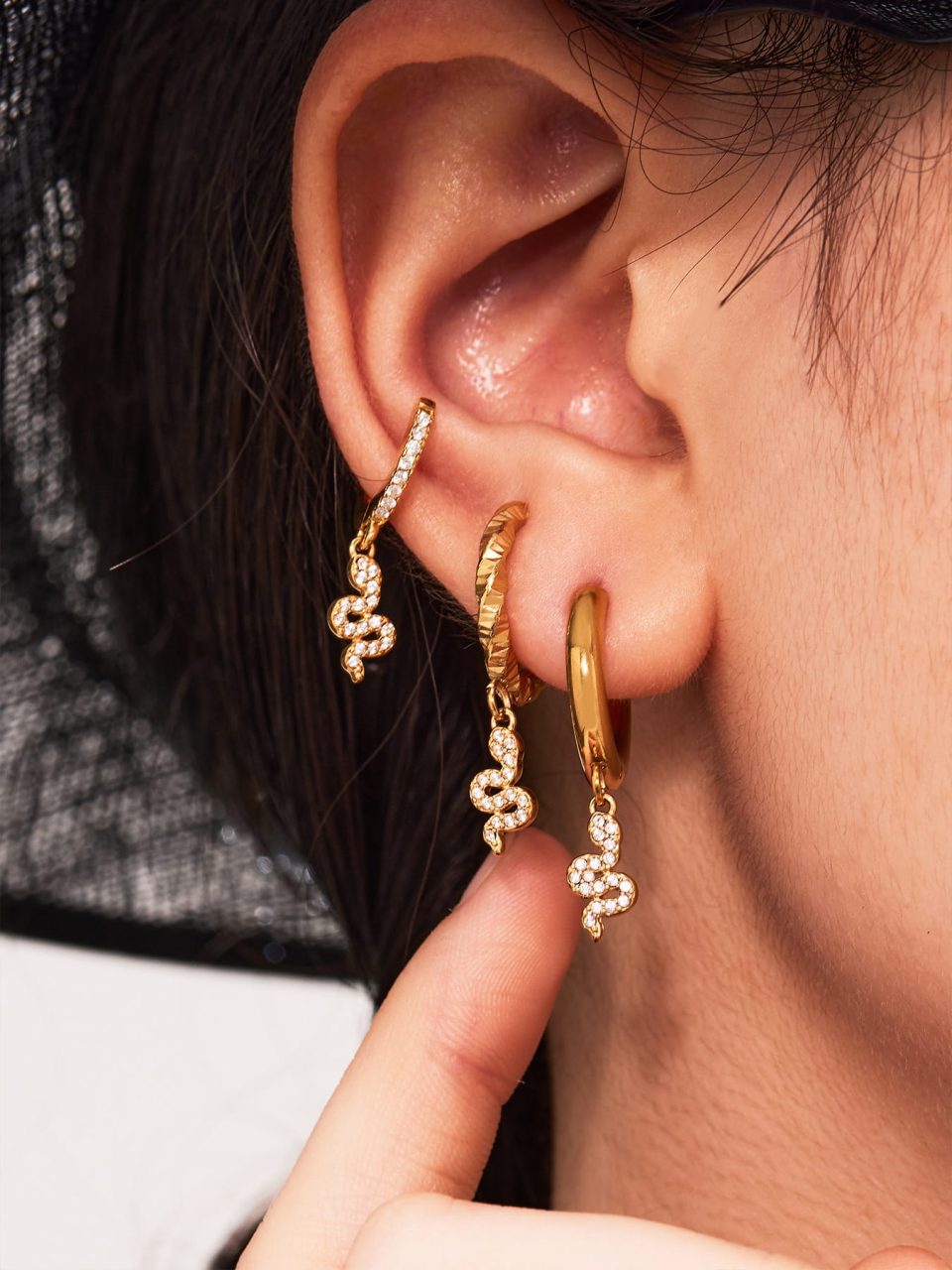 Model wearing gold zircon earrings Q159