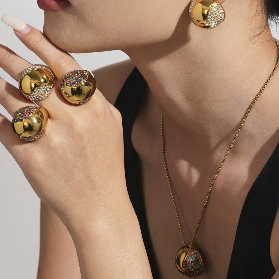 Model wearing gold Hollow Half Hoop Cubic Zirconia Earrings, stainless steel jewelry.