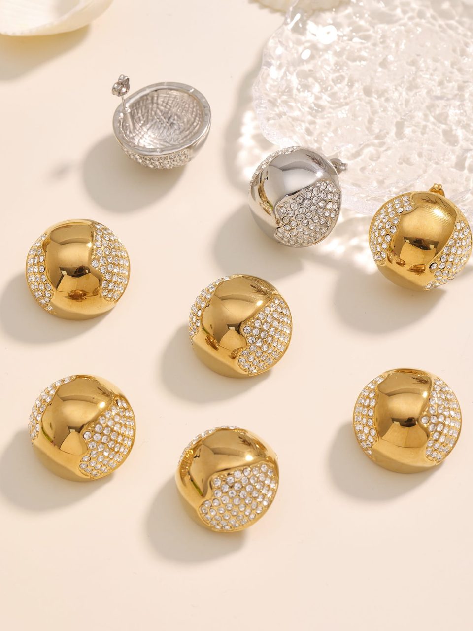 Hollow Half Hoop Cubic Zirconia Earrings in gold stainless steel, lifestyle scene with warm tones.