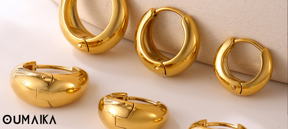 Gold hoop earrings in multiple sizes, Oumaika Fall 2025 waterproof jewelry trends