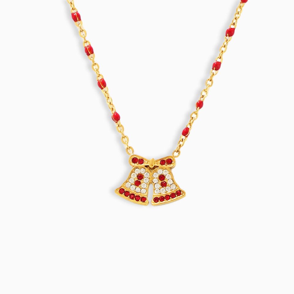 Gold Christmas reindeer pendant necklace with bell and zircon stone on white background