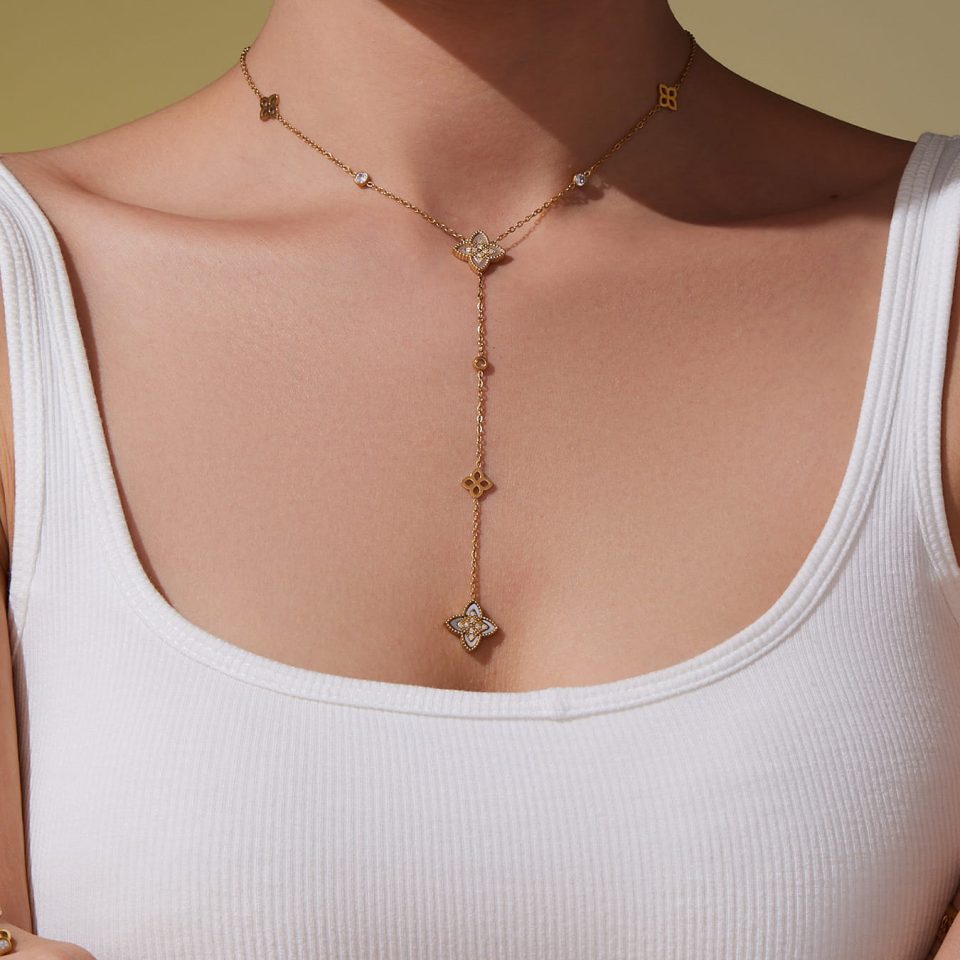 Model wearing a gold Y necklace P155