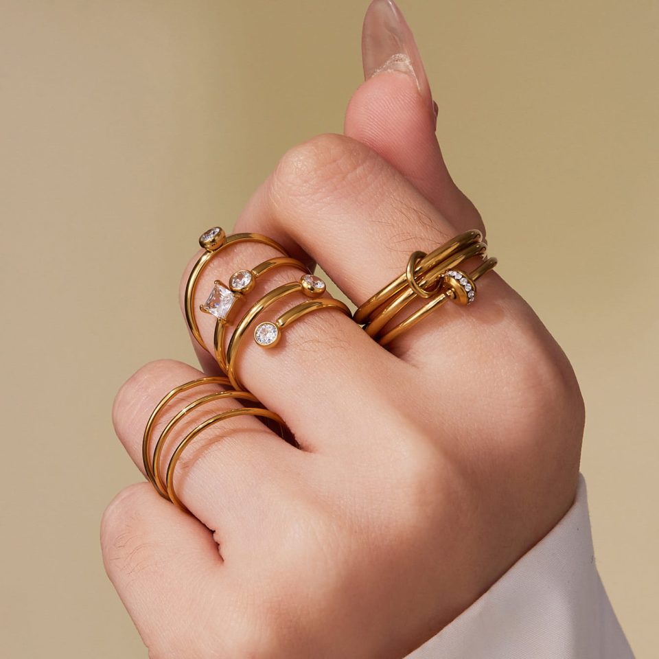 Model wearing a gold geometric layered ring A313