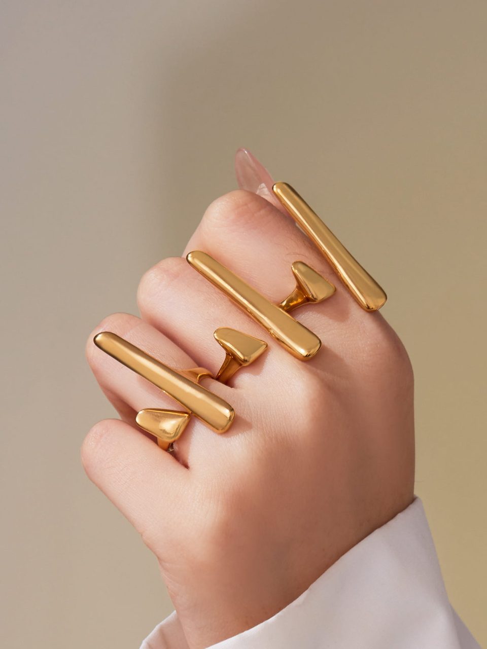Model wearing a gold geometric ring A080