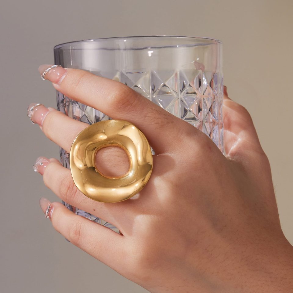 Model wearing a gold geometric ring A701