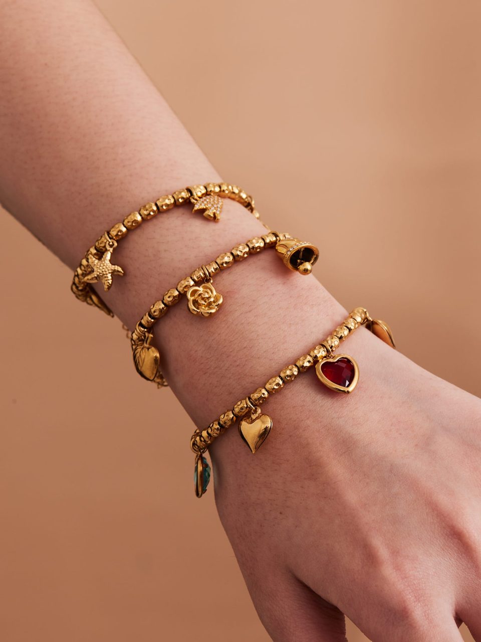 Model wearing a gold heart zircon bracelet E180
