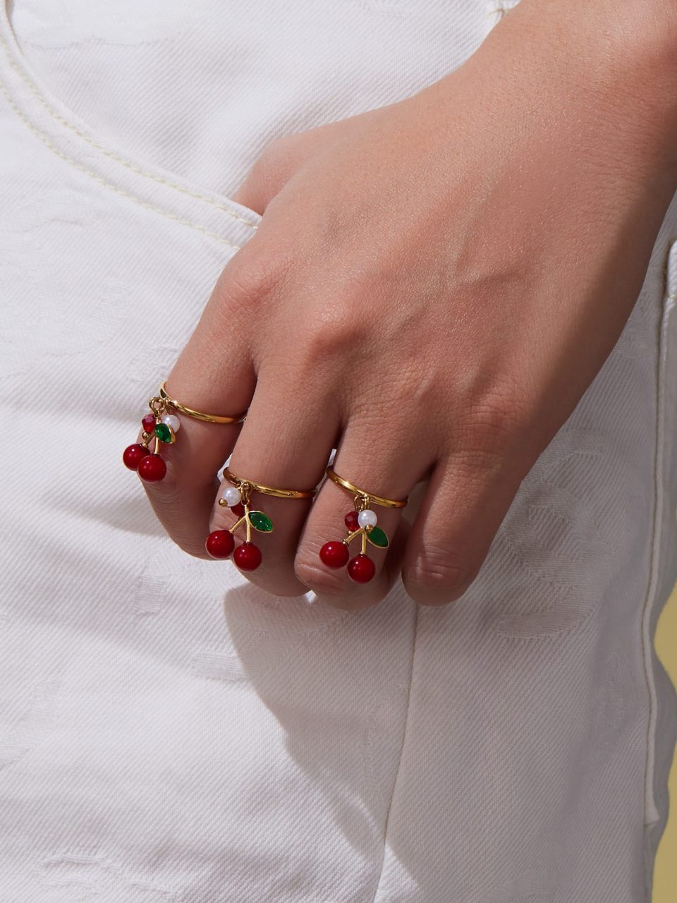 Model wearing a gold ring TXA407