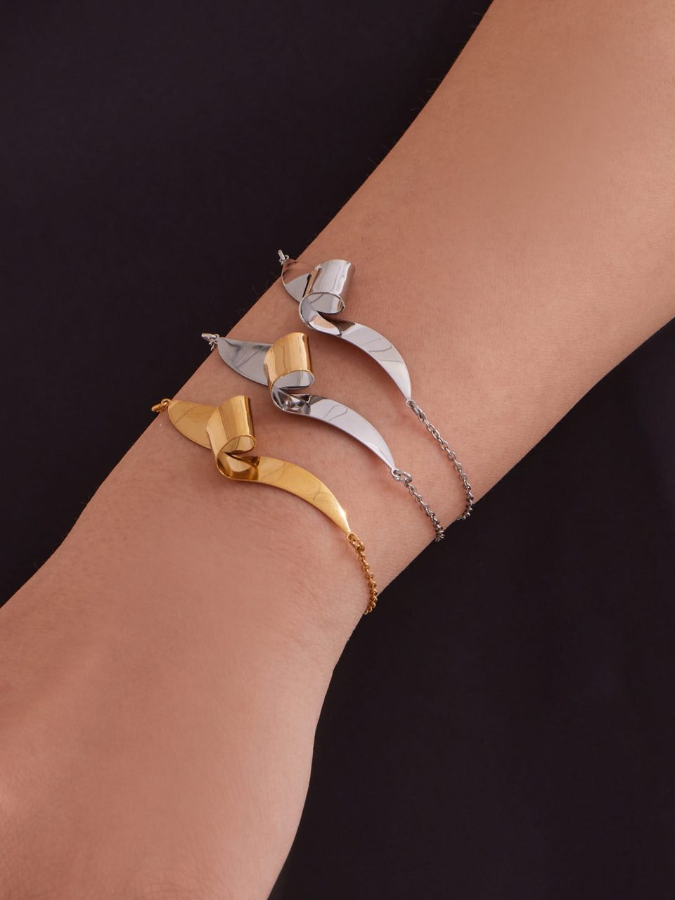 Model wearing a gold silver geometric bracelet TXE404