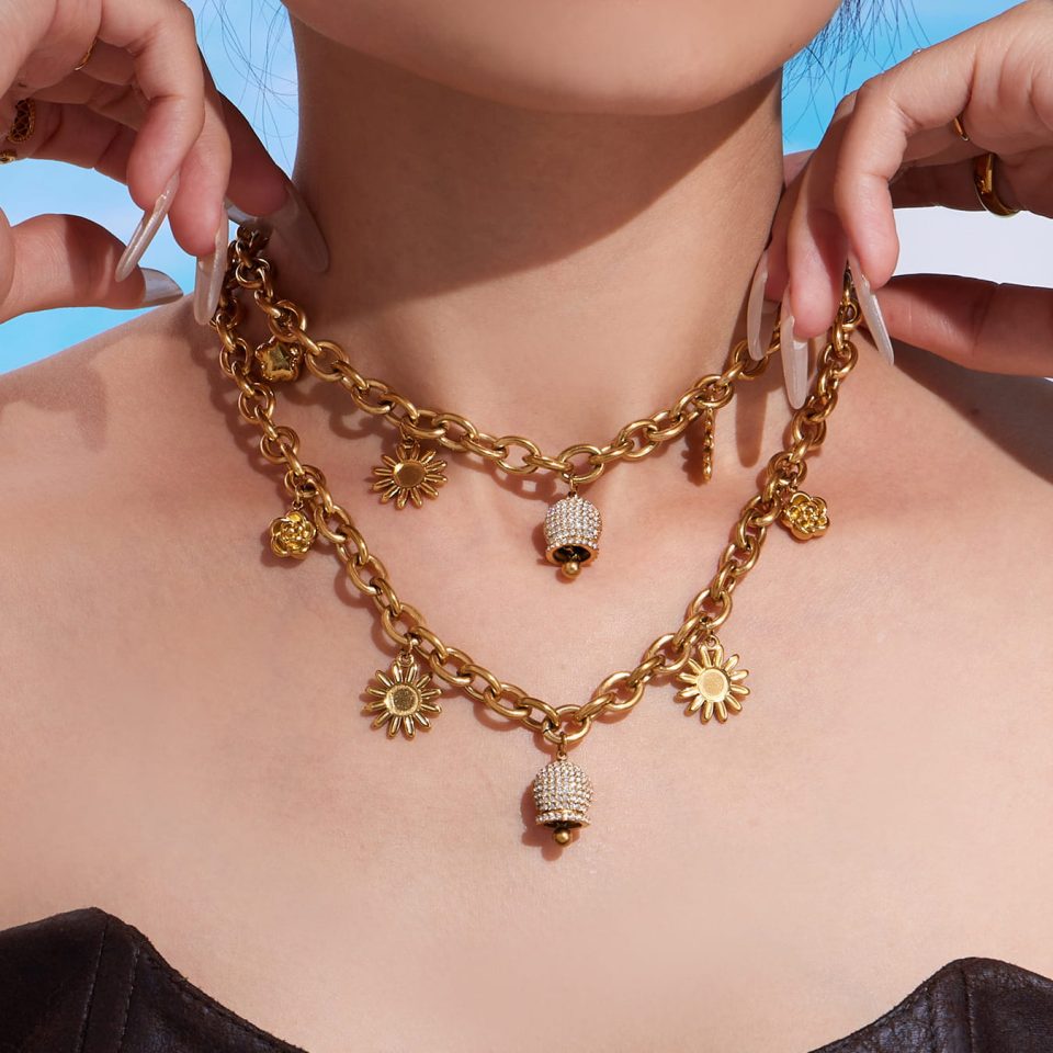 Model wearing a gold zircon bell necklace TXP408