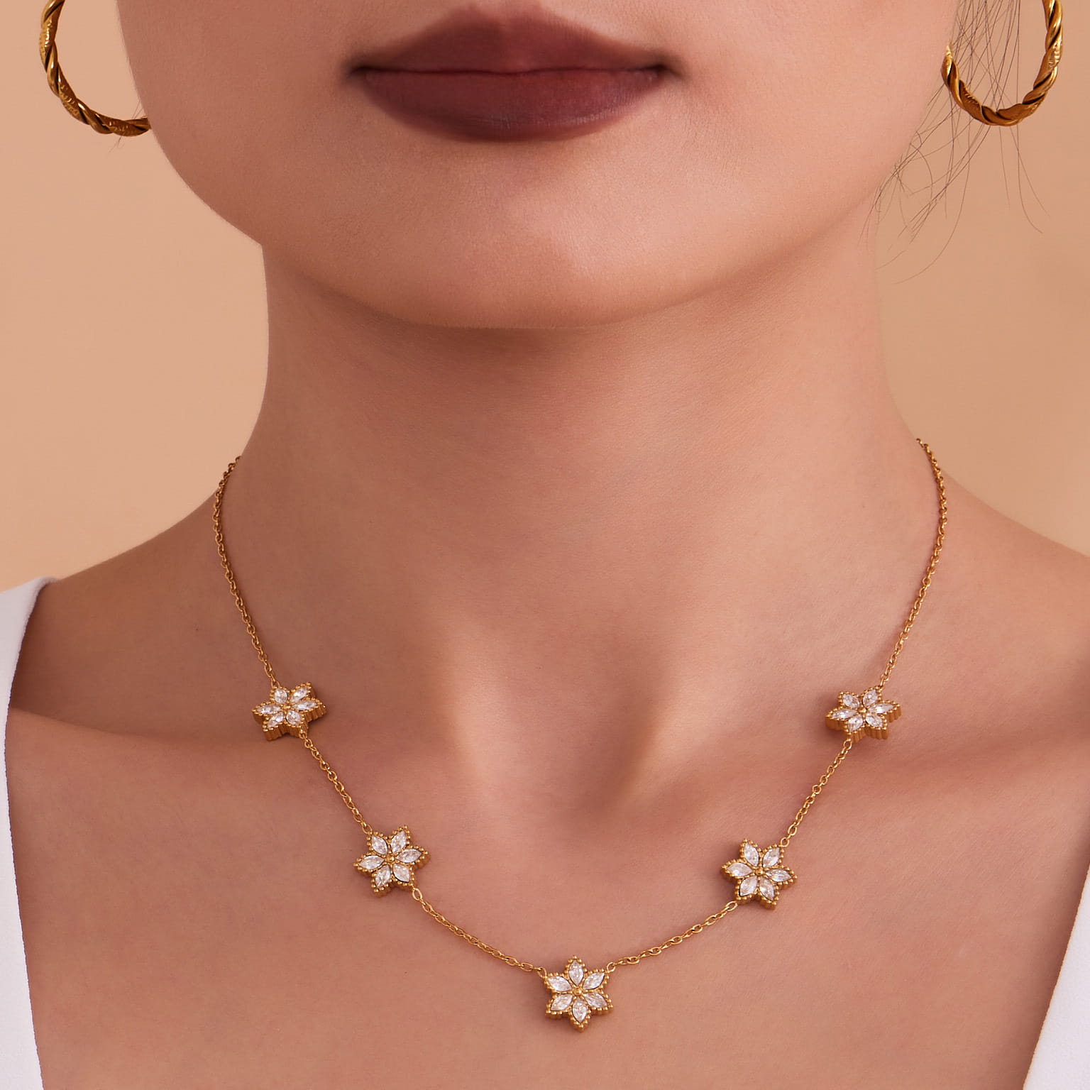 Model wearing a golden flower zircon necklace TXP375-