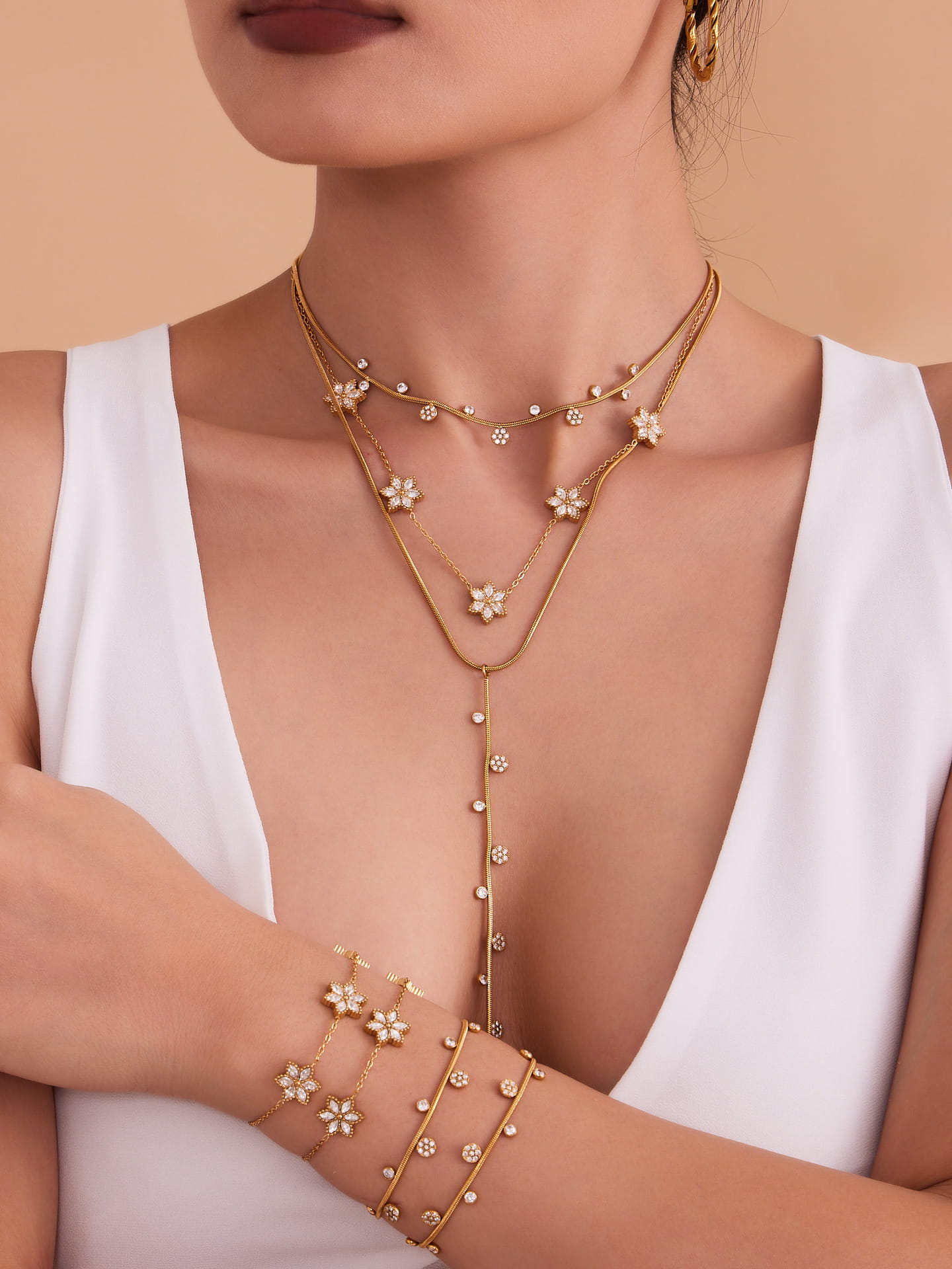 Model wearing a golden flower zircon necklace TXP375
