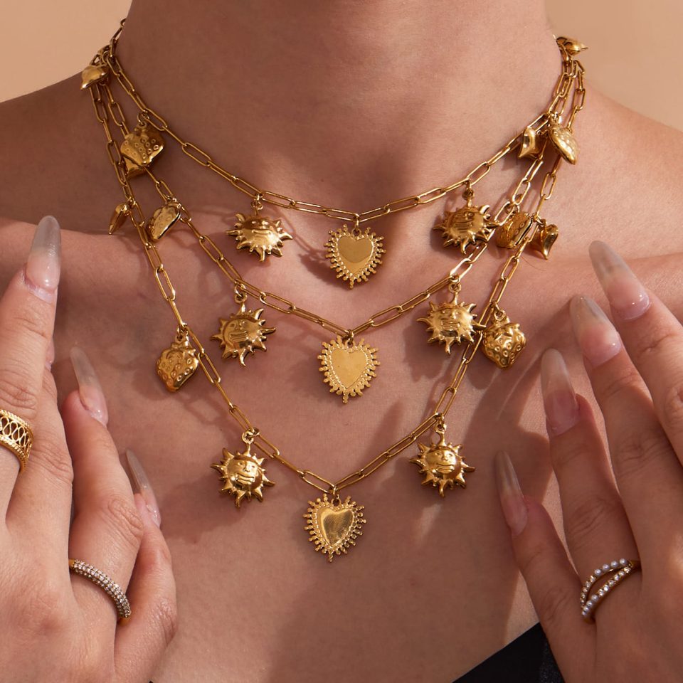 Model wearing a hollow sun heart necklace P1100-