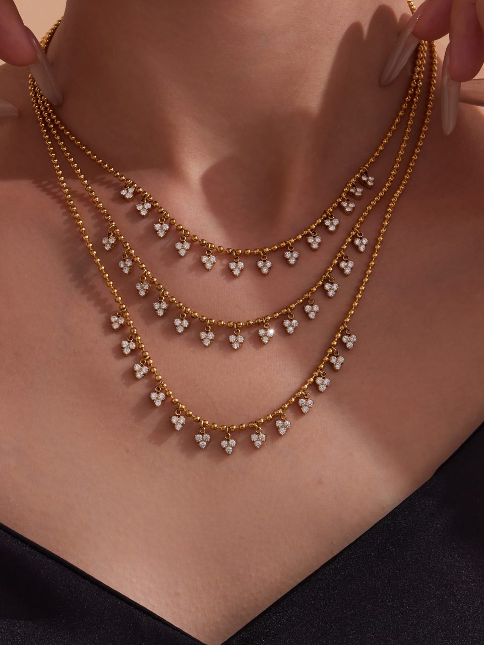 Model wearing gold triangle tassel diamond necklace TXP391