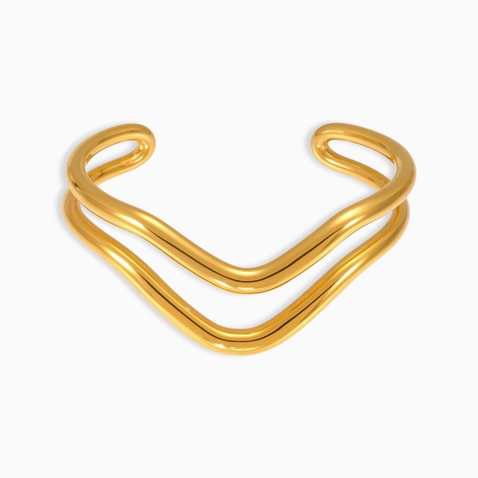 Wavy open cuff bracelet made of gold stainless steel minimalist bangle on white background