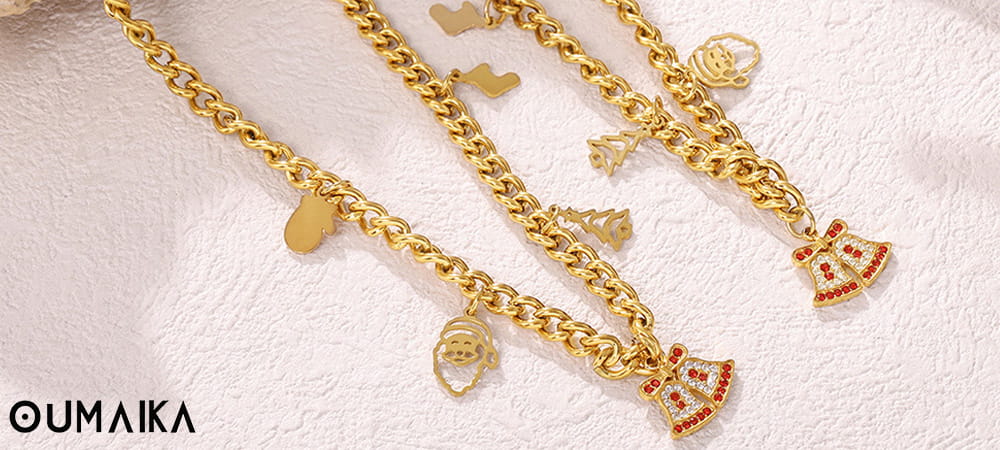 Gold-toned Christmas charm bracelets with Santa, bell, and tree pendants – Oumaika Jewelry.
