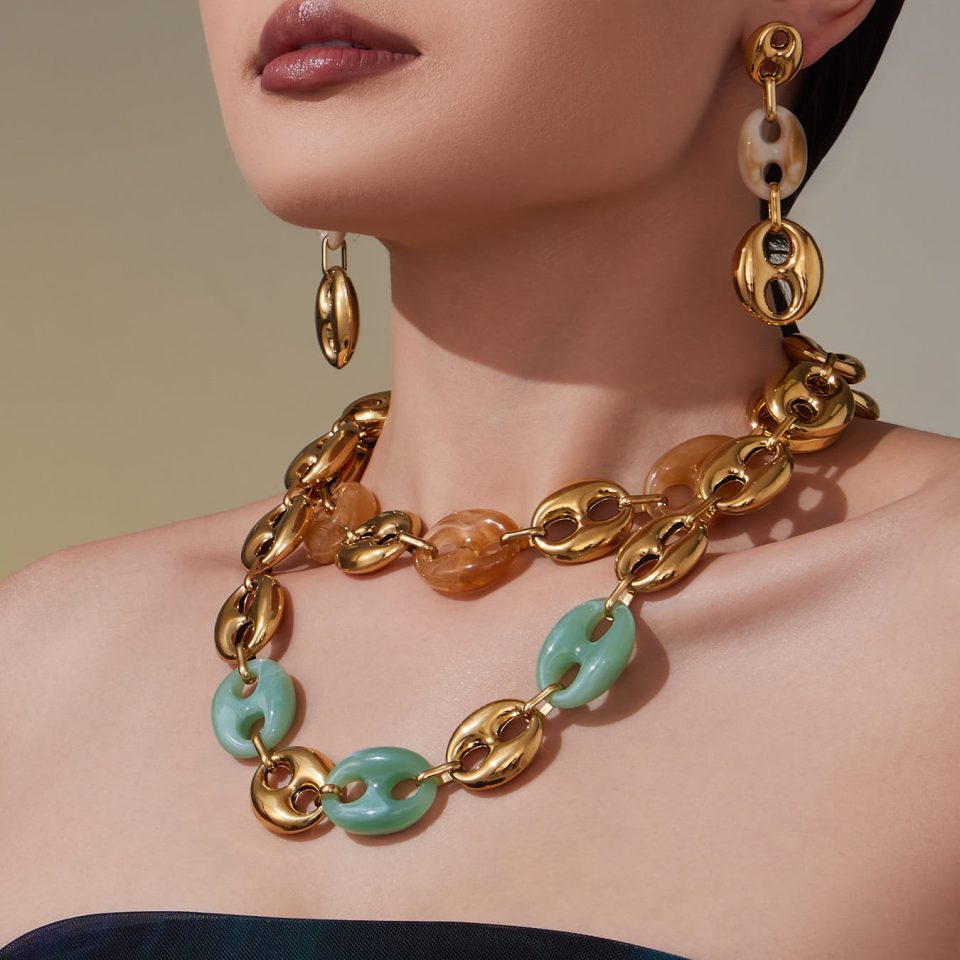 Model wearing a pig nose necklace TXP430